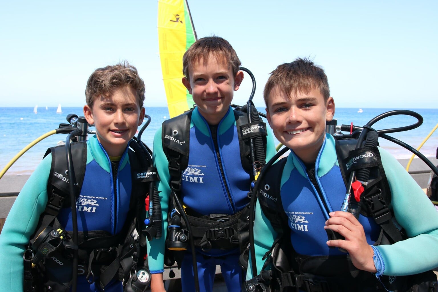 Three campers in scuba diving gear.