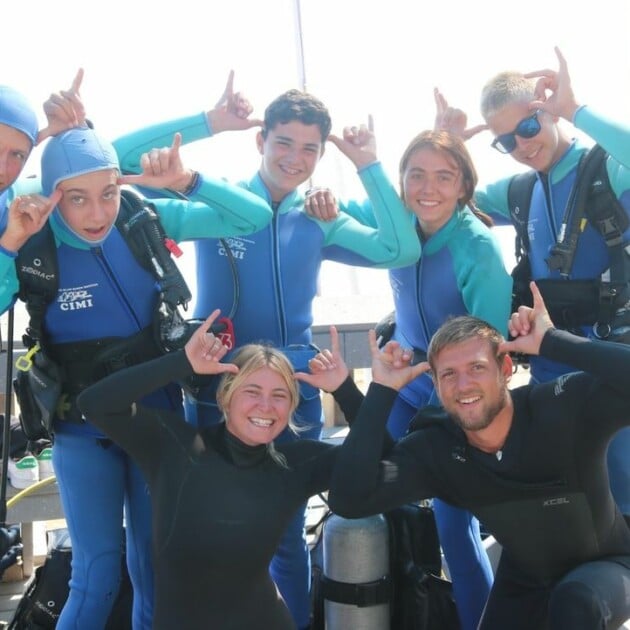 A group of campers in scuba diving gear.