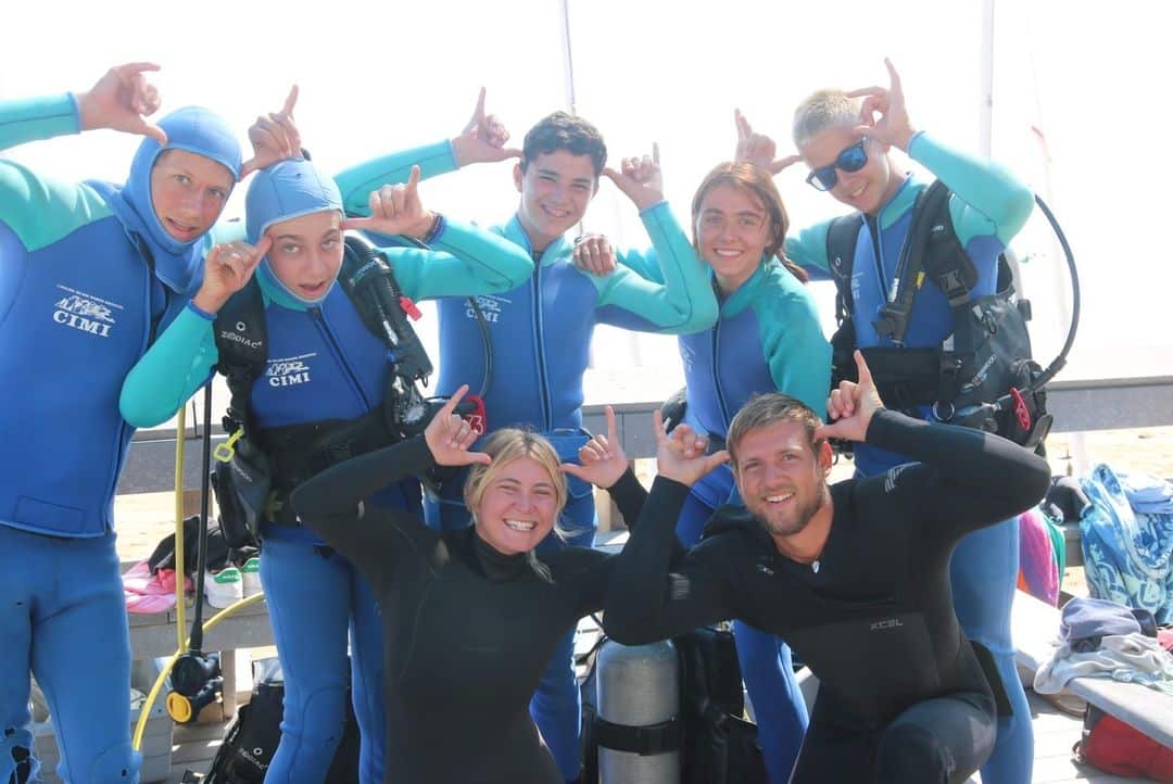 A group of campers in scuba diving gear.