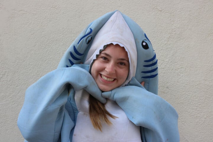 Gianna, a member of the summer camp staff, in a shark costume.