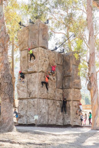 Campers on the Toyon Bay climbing wall.